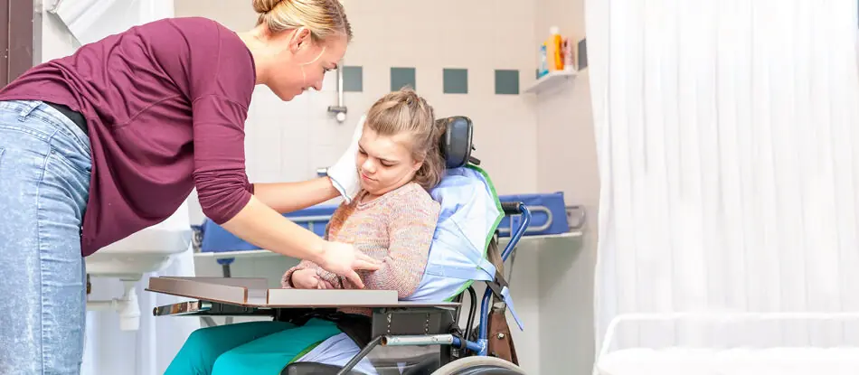 Support worker assisting a participant with personal activities
